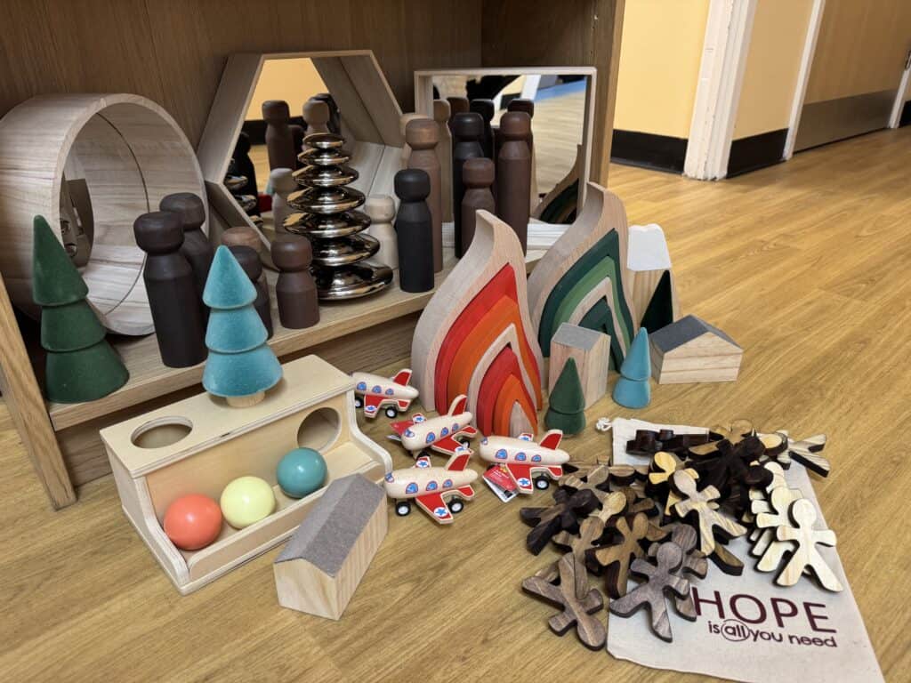 Colourful educational wooden toys and blocks for children at Thrive Childcare, fostering creativity and cognitive development in a safe, nurturing environment.