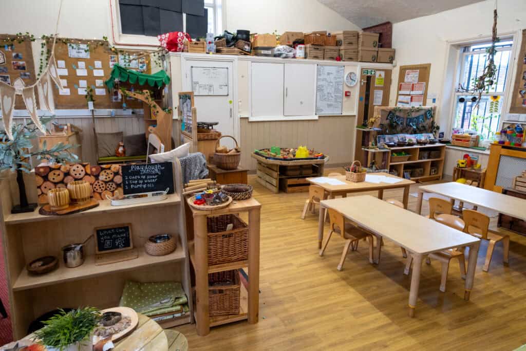 Colourful indoor childcare classroom at Thrive Childcare with child-sized tables, educational toys, art supplies, and cosy play zones, creating a nurturing environment for early childhood development.