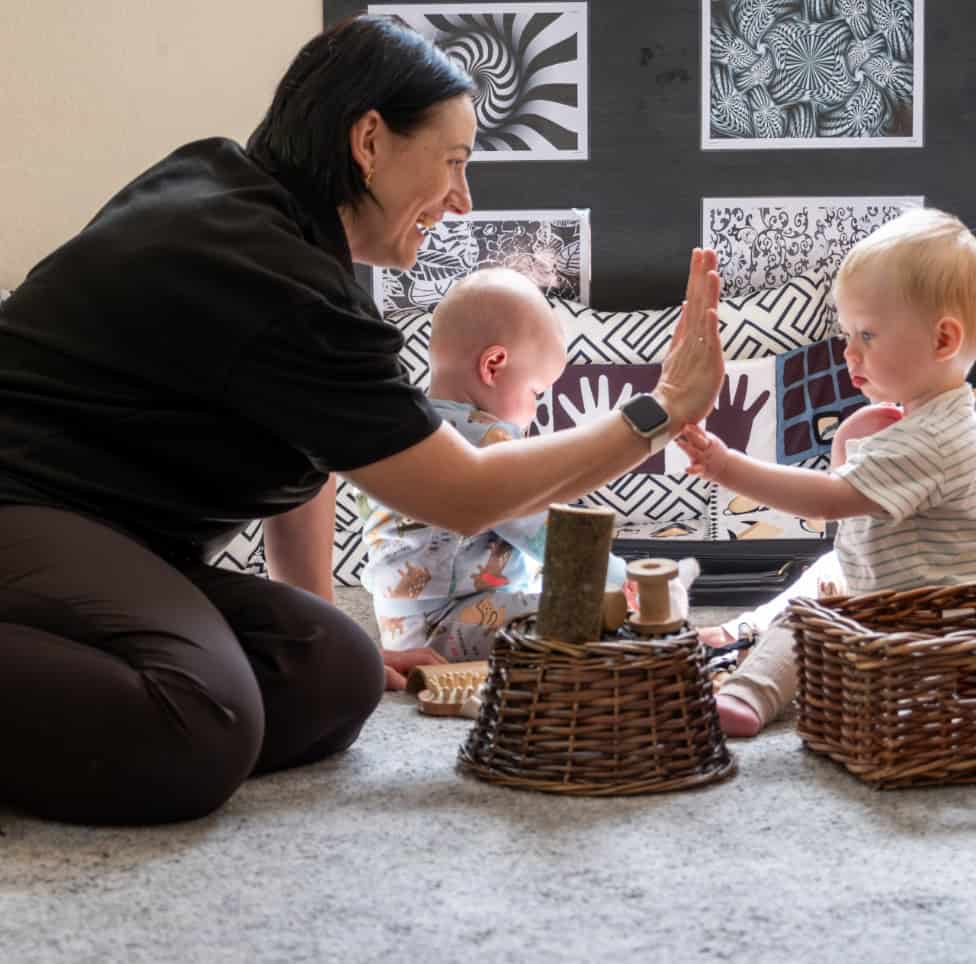 Playing with young children in a nursery setting at Thrive Childcare, promoting early childhood development, learning through play, and nurturing childcare services in a safe environment.