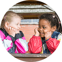 Bright, happy children enjoying outdoor play at Thrive Childcare, promoting early childhood development, learning, and social skills in a caring, safe environment.