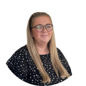 Bright-eyed childcare professional at Thrive Childcare, dedicated to nurturing and supporting children's growth in a safe, engaging environment.