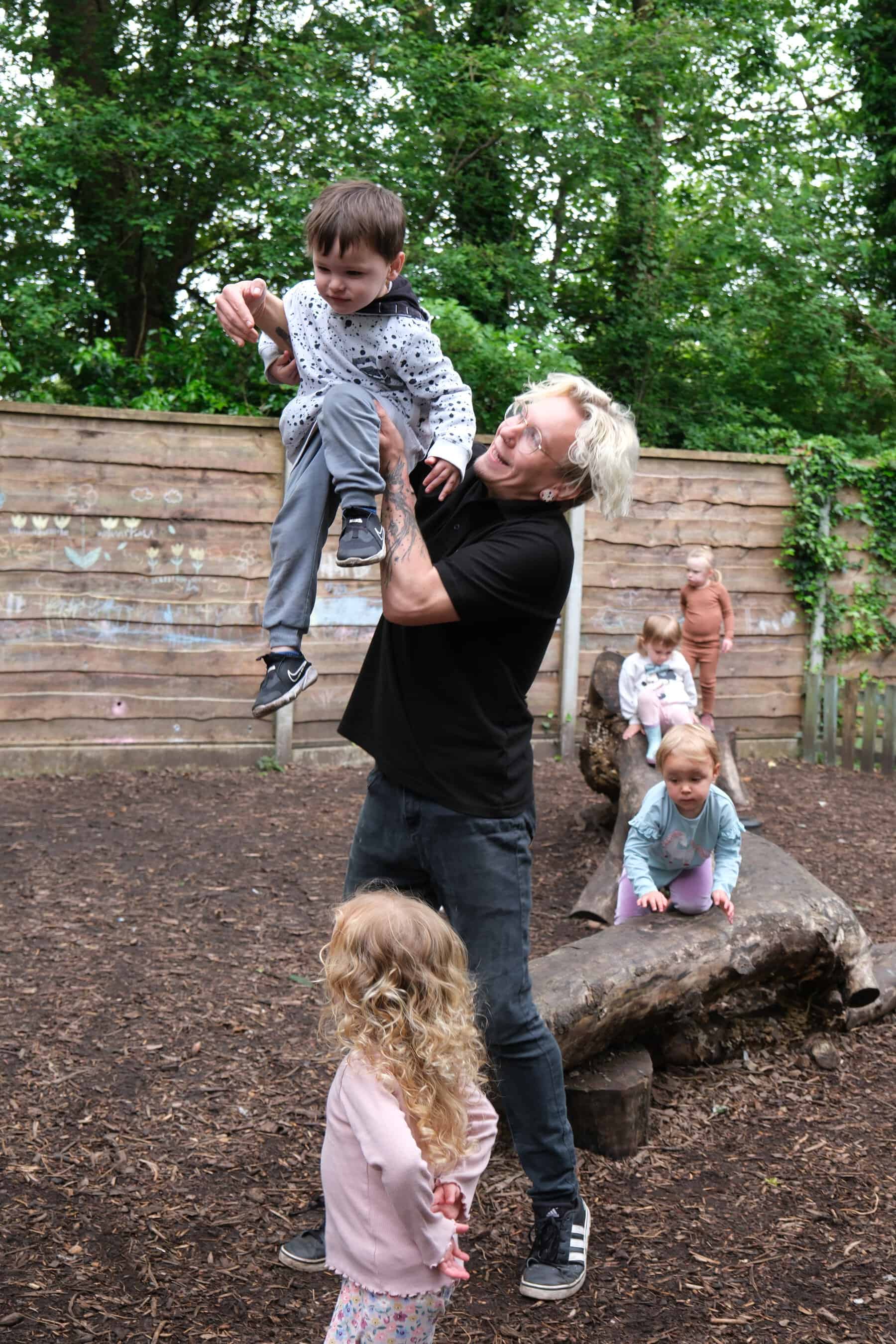 Bright outdoor play area at Thrive Childcare with children engaging in supervised activities, fostering social skills, confidence, and outdoor learning for early childhood development.