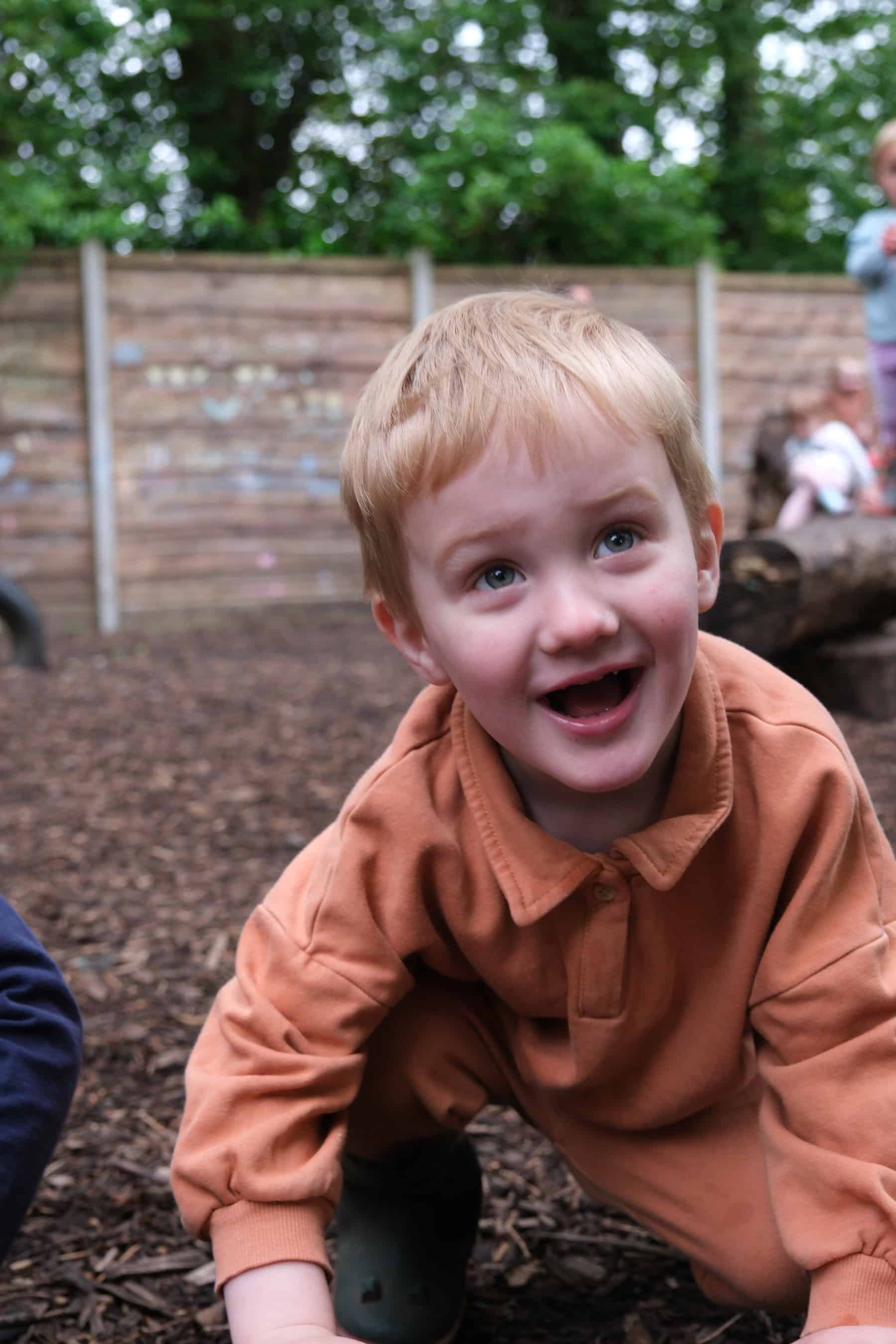 Playing outdoors at Thrive Childcare, showcasing engaging child-friendly activities and a safe environment for young children's development.