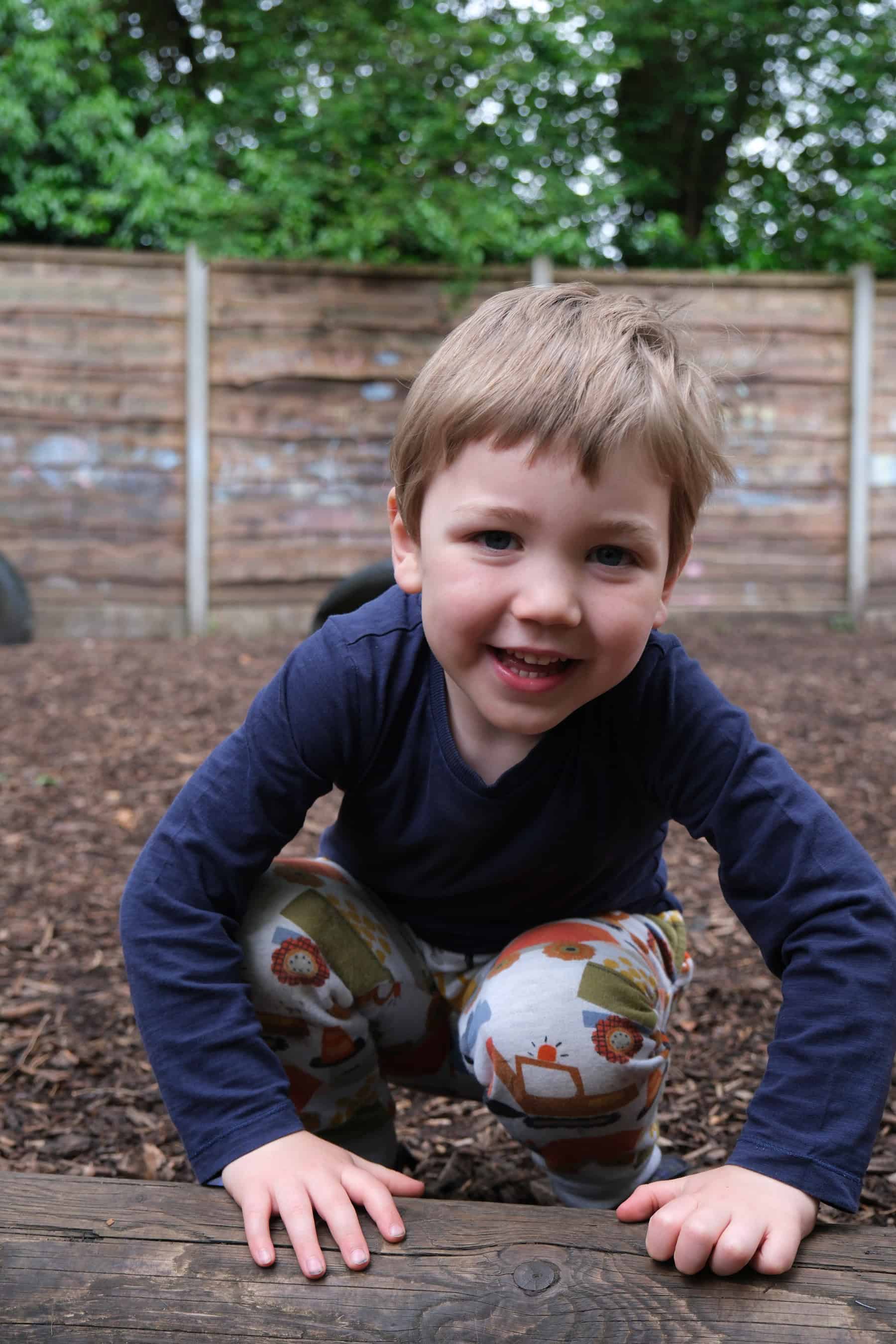 Healthy, happy child actively playing outdoors in a safe, nurturing childcare environment at Thrive Childcare, promoting early childhood development and outdoor learning experiences.
