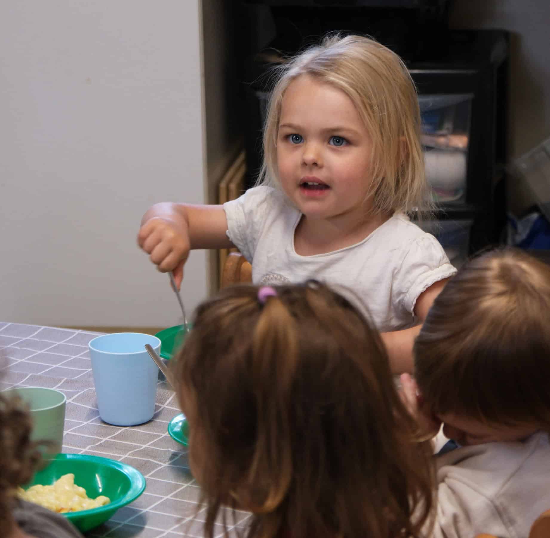 Miniature girl with blonde hair engaging children’s activities at Thrive Childcare, promoting early childhood development and nurturing learning environments for young children.