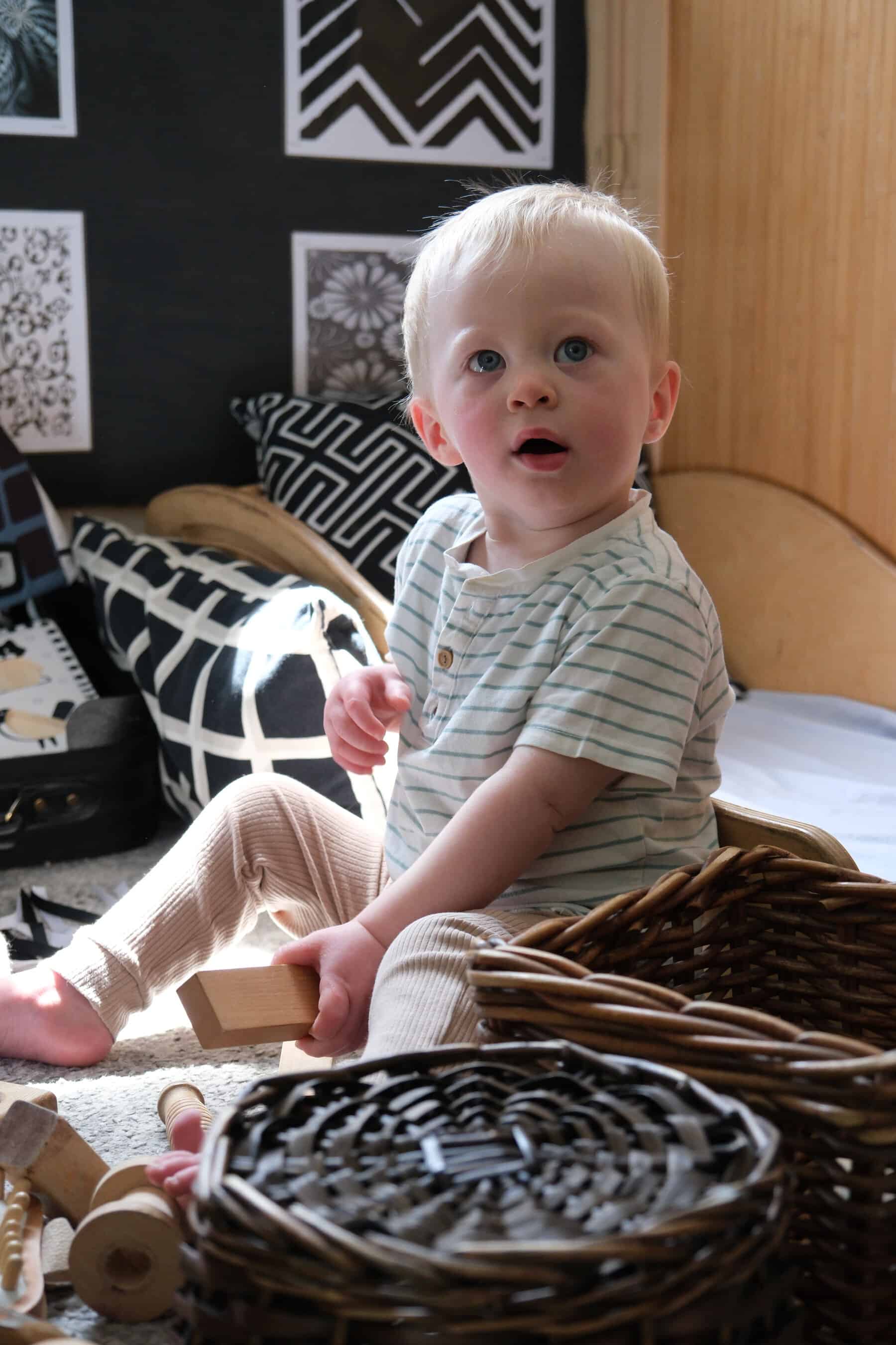 Bright young child exploring toys and activities at Thrive Childcare, fostering early development and learning in a nurturing environment.
