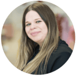 Brightly lit classroom at Thrive Childcare with engaged children and caring staff, fostering a safe and nurturing environment for early childhood learning and development.