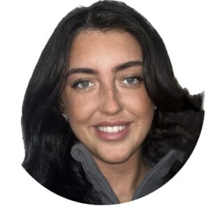 Bright smiling woman with dark hair, representing a happy childcare professional at Thrive Childcare, promoting quality early childhood education and development services in the UK.