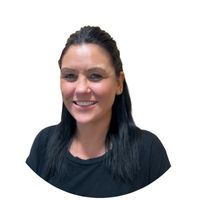 Bright smiling childcare professional at Thrive Childcare, dedicated to nurturing and caring for children's development and well-being.