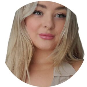 Bright smiling woman with blonde hair and blue eyes, representing caring childcare staff at Thrive Childcare, providing a nurturing environment for children's early development and learning.