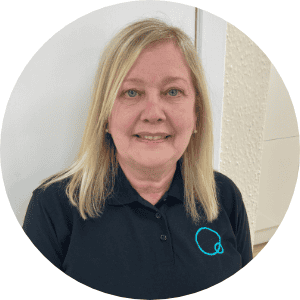 Bright smiling childcare professional at Thrive Childcare, providing nurturing early years education and care for young children in a welcoming environment.