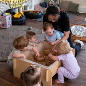 Engaging preschool children at Thrive Childcare enjoying sensory play and hands-on activities in a safe, nurturing environment.