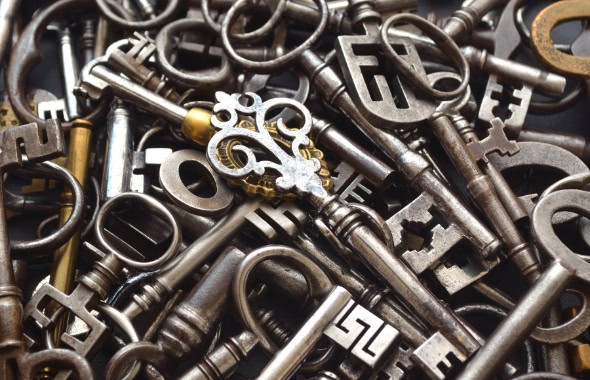 Old vintage keys and keyholes symbolising security and access.