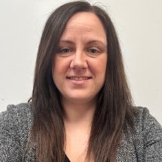 Bright smiling childcare professional at Thrive Childcare, supporting early childhood development and nurturing learning environments in the UK.