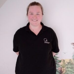 Caring childcare professional at Thrive Childcare centre, providing a safe and nurturing environment for children's early education and development, with staff dedicated to their wellbeing.