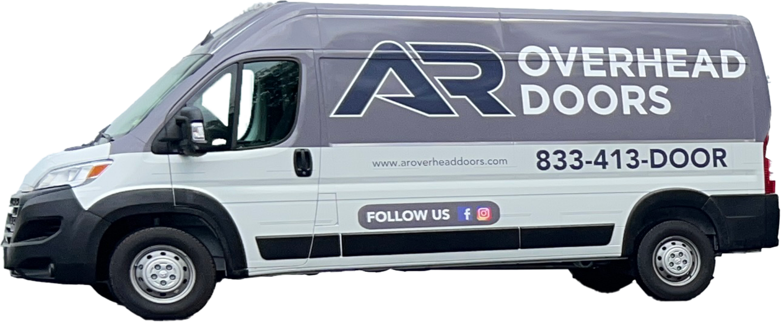 A van showcasing "AR Overhead Doors" branding cruises through the service area with its contact number, website, and social media icons prominently displayed on its side.