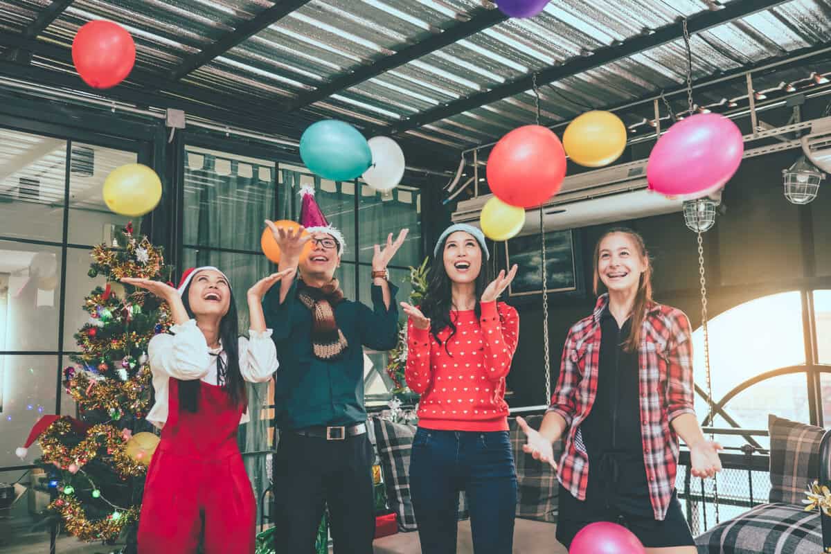 Group of friends celebrating Christmas at home,they are having f