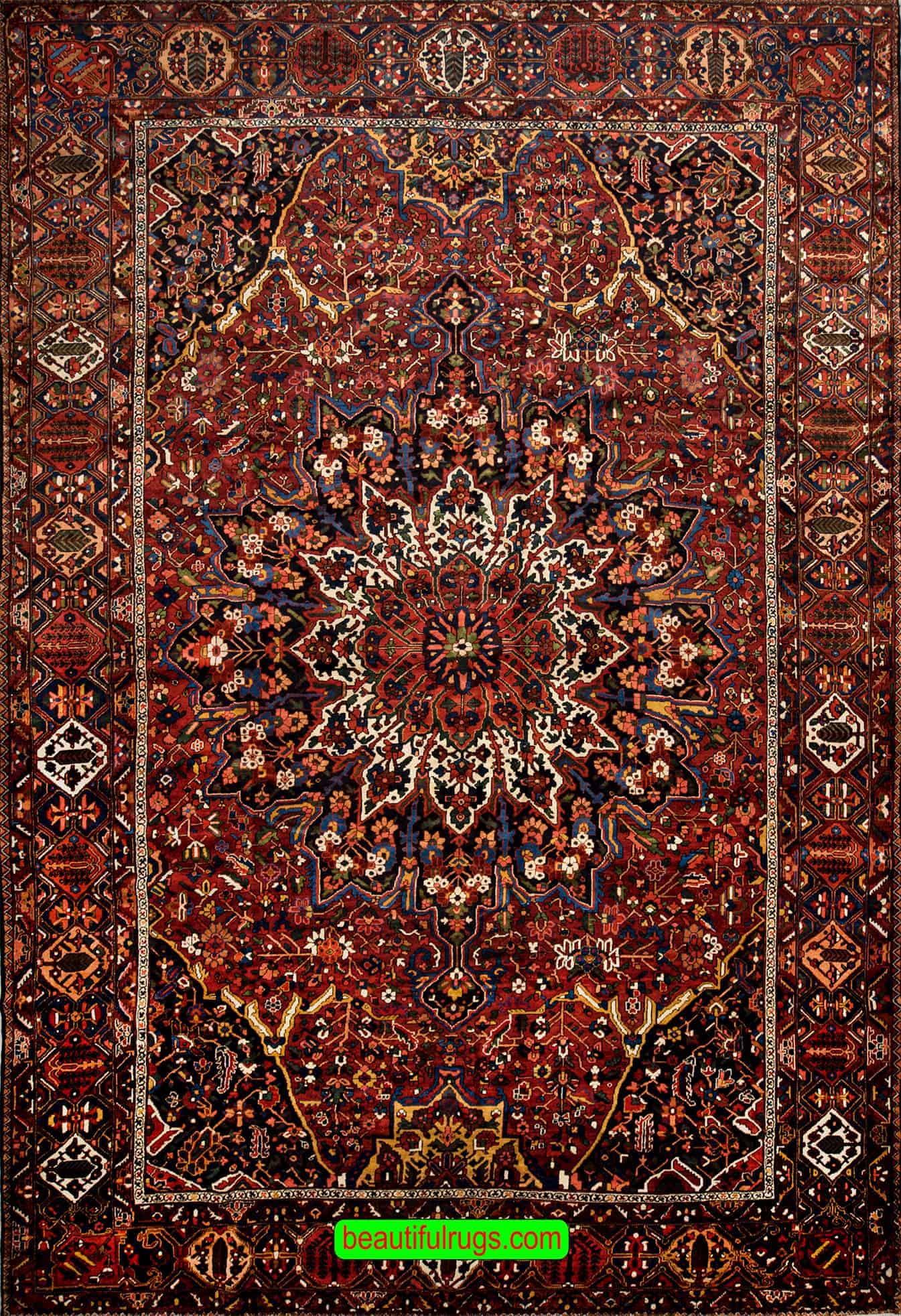 Antique Persian Bakhtiari rugs, floral, geometric rug in red color. Size 12.2x17.