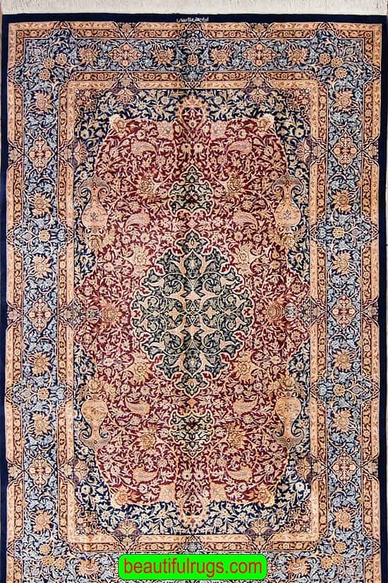 Persian silk rug with red and navy blue color. Size 5x8.7