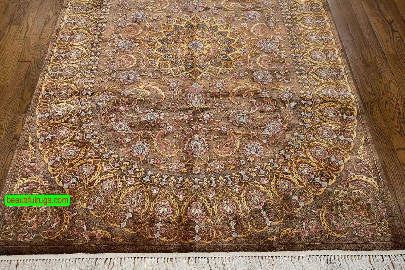 Handmade brown Persian silk rug with brown and gold colors. Size 4.4x6.9.