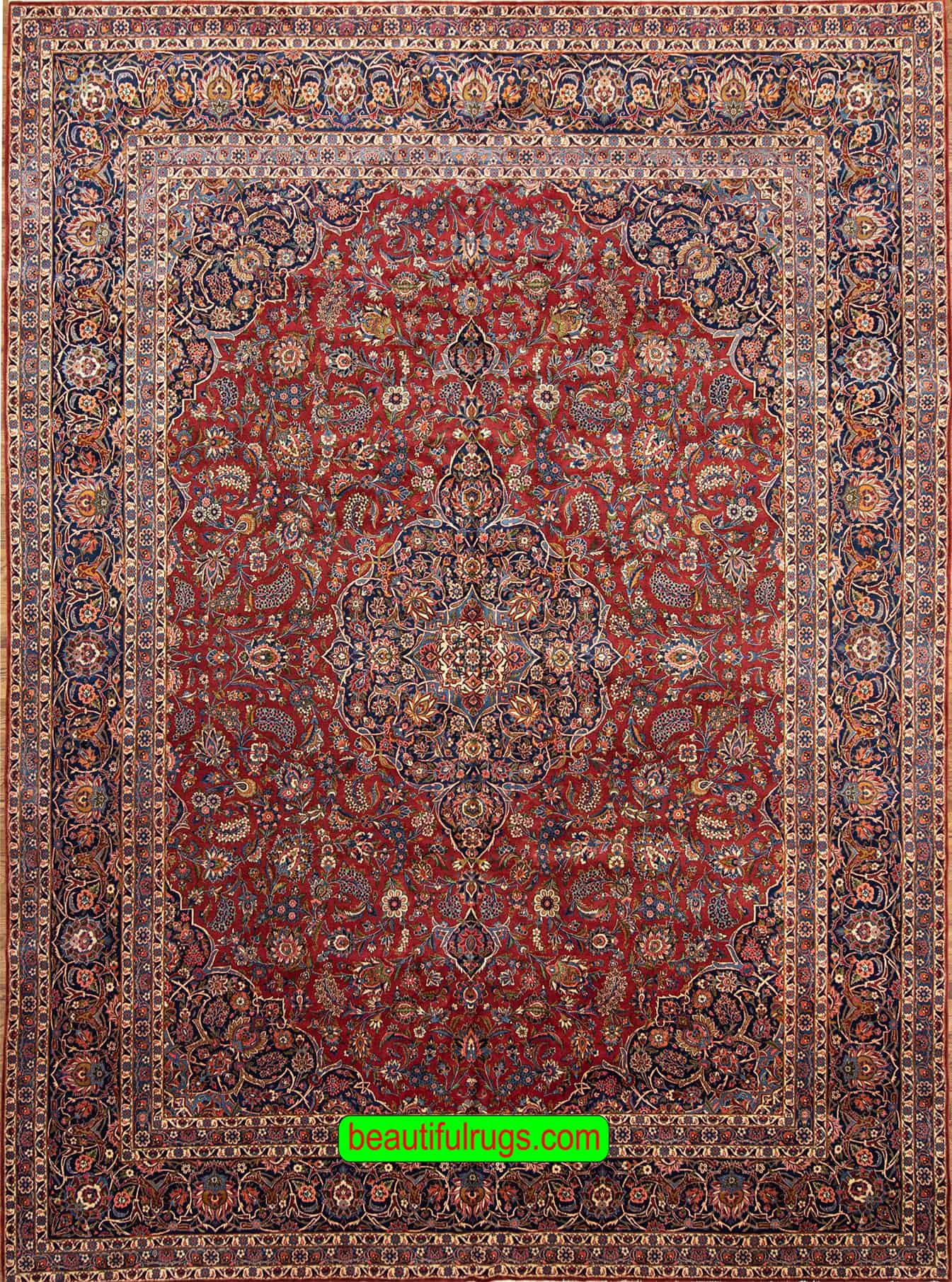 Semi antique Persian Kashan rug with orange red and navy blue color. Size 11.3x14.7.