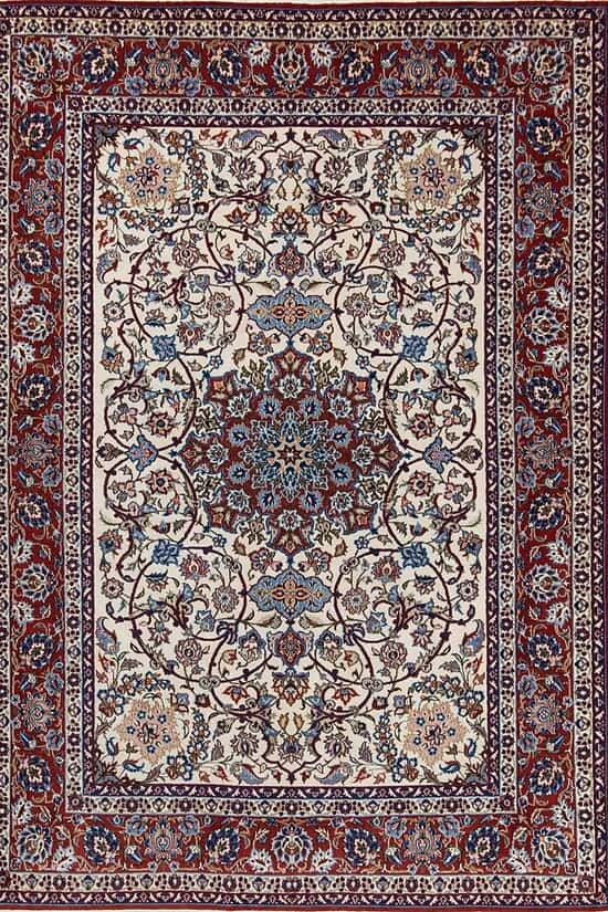 Authentic handmade antique Persian Isfahan Wool rug with beige and red colors. Rug size 5x7.