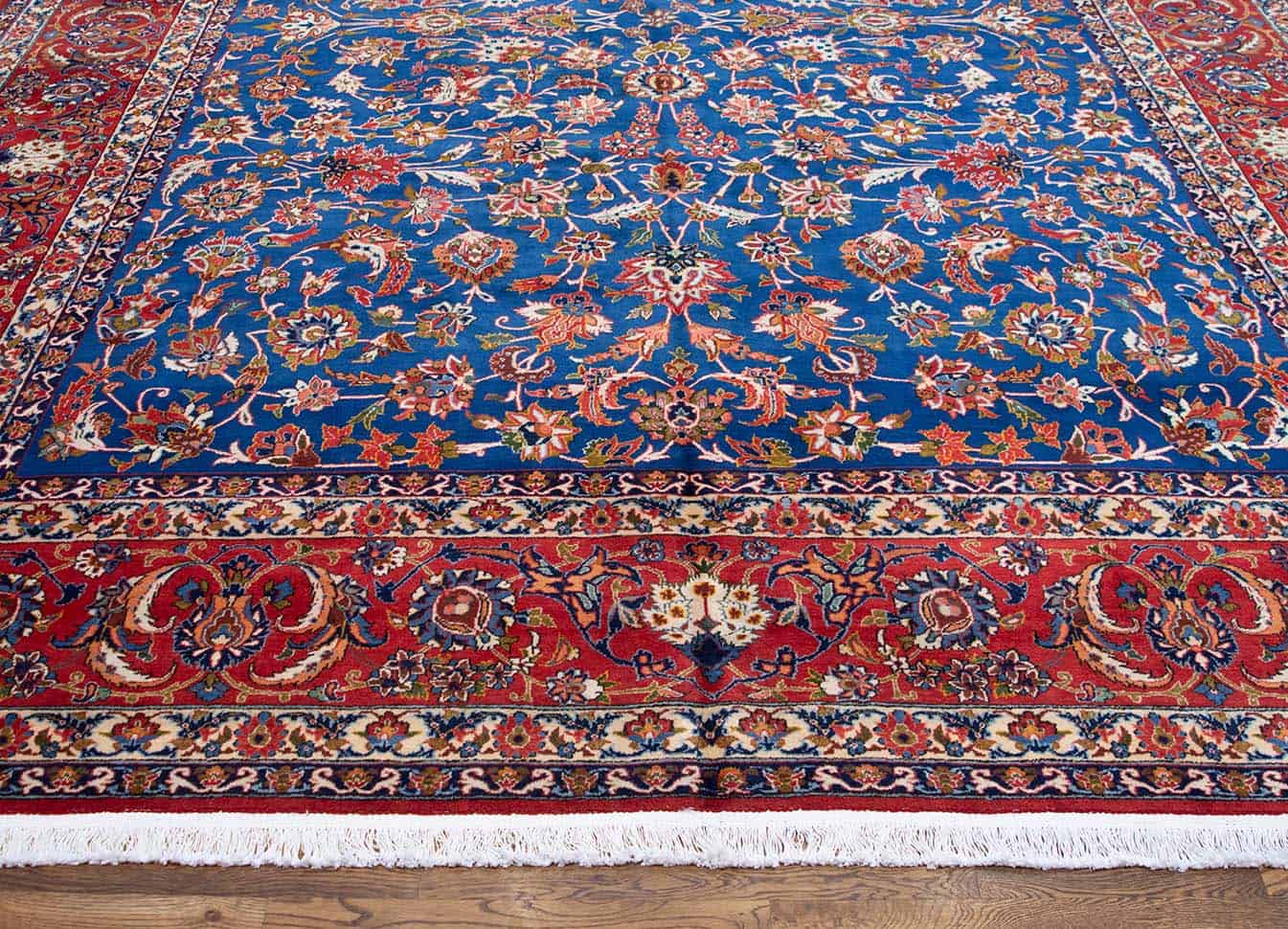 Vintage Persian Isfahan rug. Handmade wool Persian Isfahan rug, floral allover design in blue and terracotta color. Size 10x14.