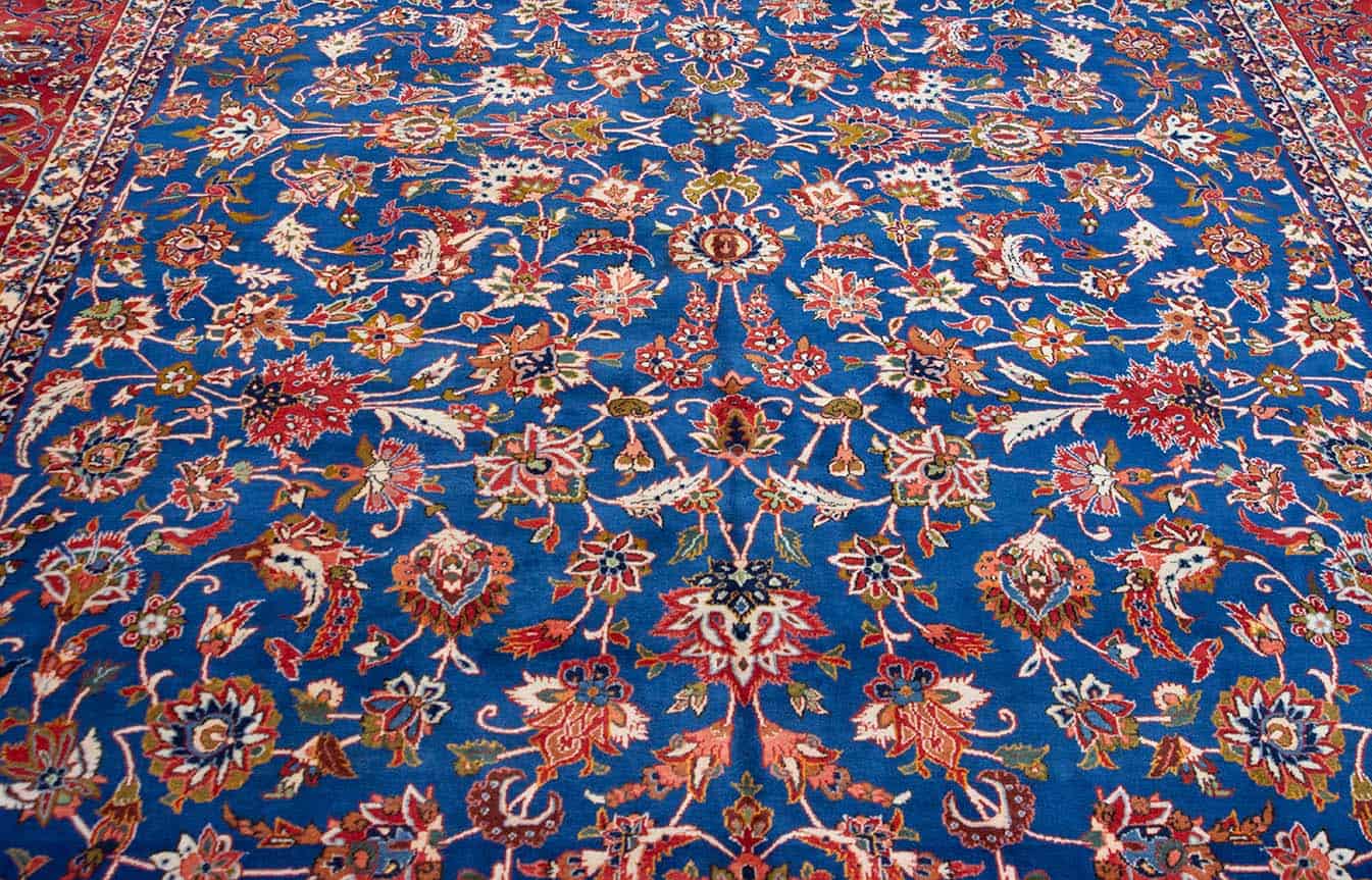Vintage Persian Isfahan rug. Handmade wool Persian Isfahan rug, floral allover design in blue and terracotta color. Size 10x14.