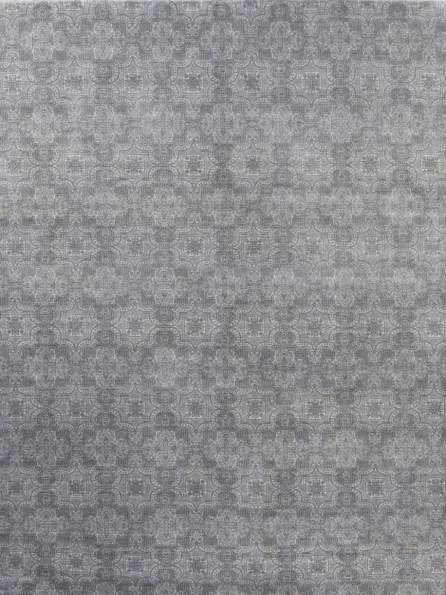 A designer contemporary rug in gray color made of wool. Size 7.10x10.1.