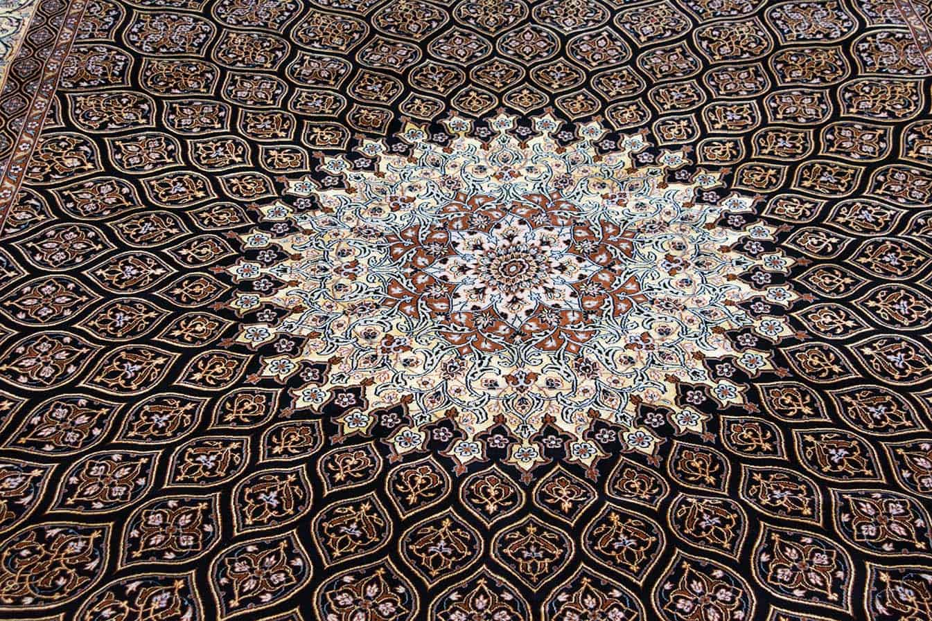 Hand woven Persian Isfahan medallion rug in black and gold colors. Size 8.3x11.8.