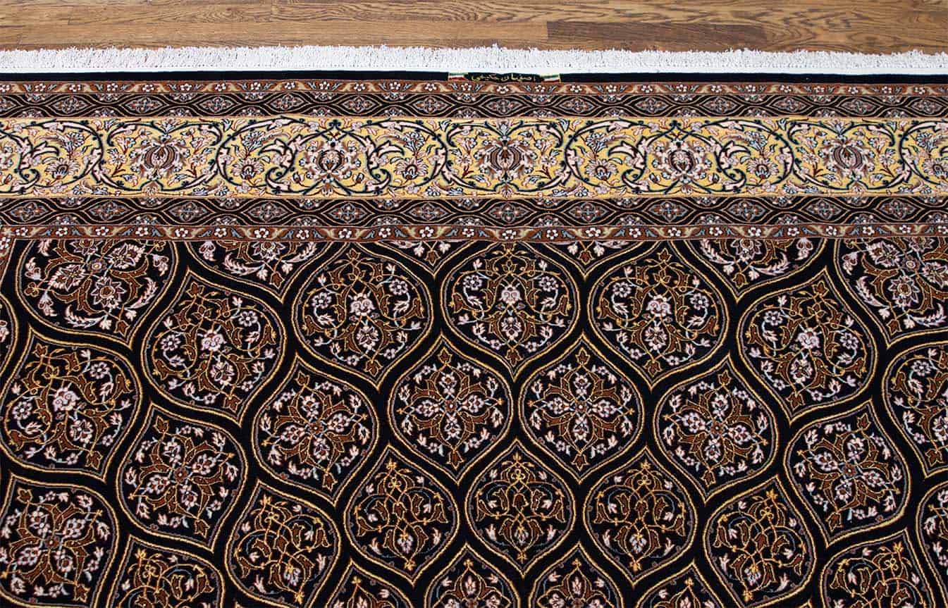 Hand woven Persian Isfahan medallion rug in black and gold colors. Size 8.3x11.8.