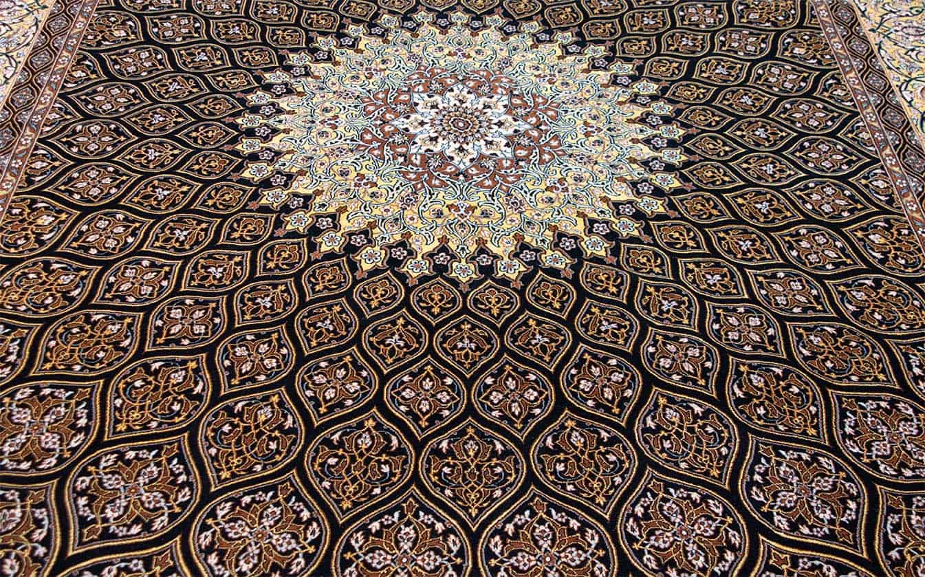 Hand woven Persian Isfahan medallion rug in black and gold colors. Size 8.3x11.8.