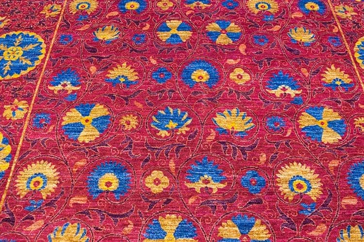 Magenta area rug designed with magenta and blue made of wool. size 8x10.3.