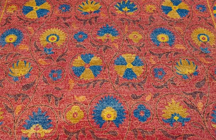 Magenta area rug designed with magenta and blue made of wool. size 8x10.3.