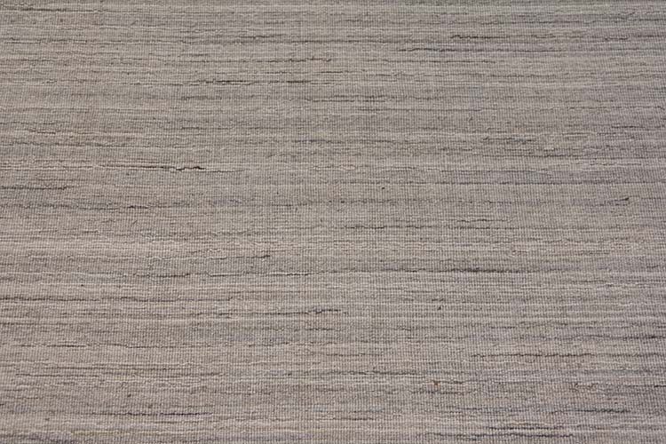 Gray area rug crafted in India; contemporary area rug made of wool. Size 9x11.7.