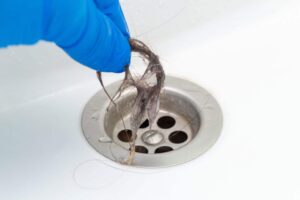 bathroom plumbing clogged by hair
