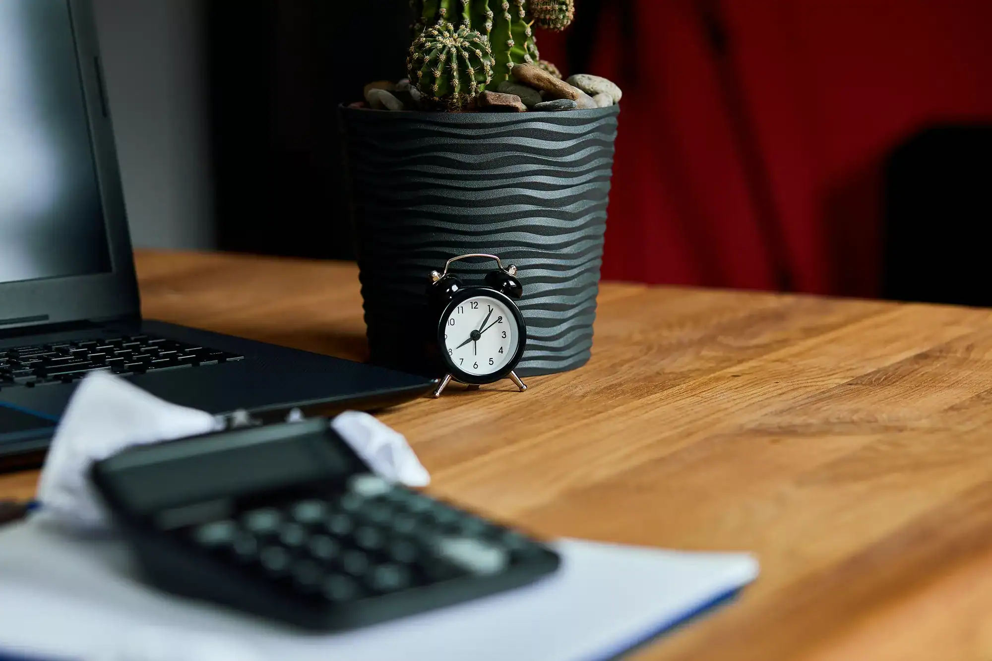 Still life of accountant workspace with office accessories calculator