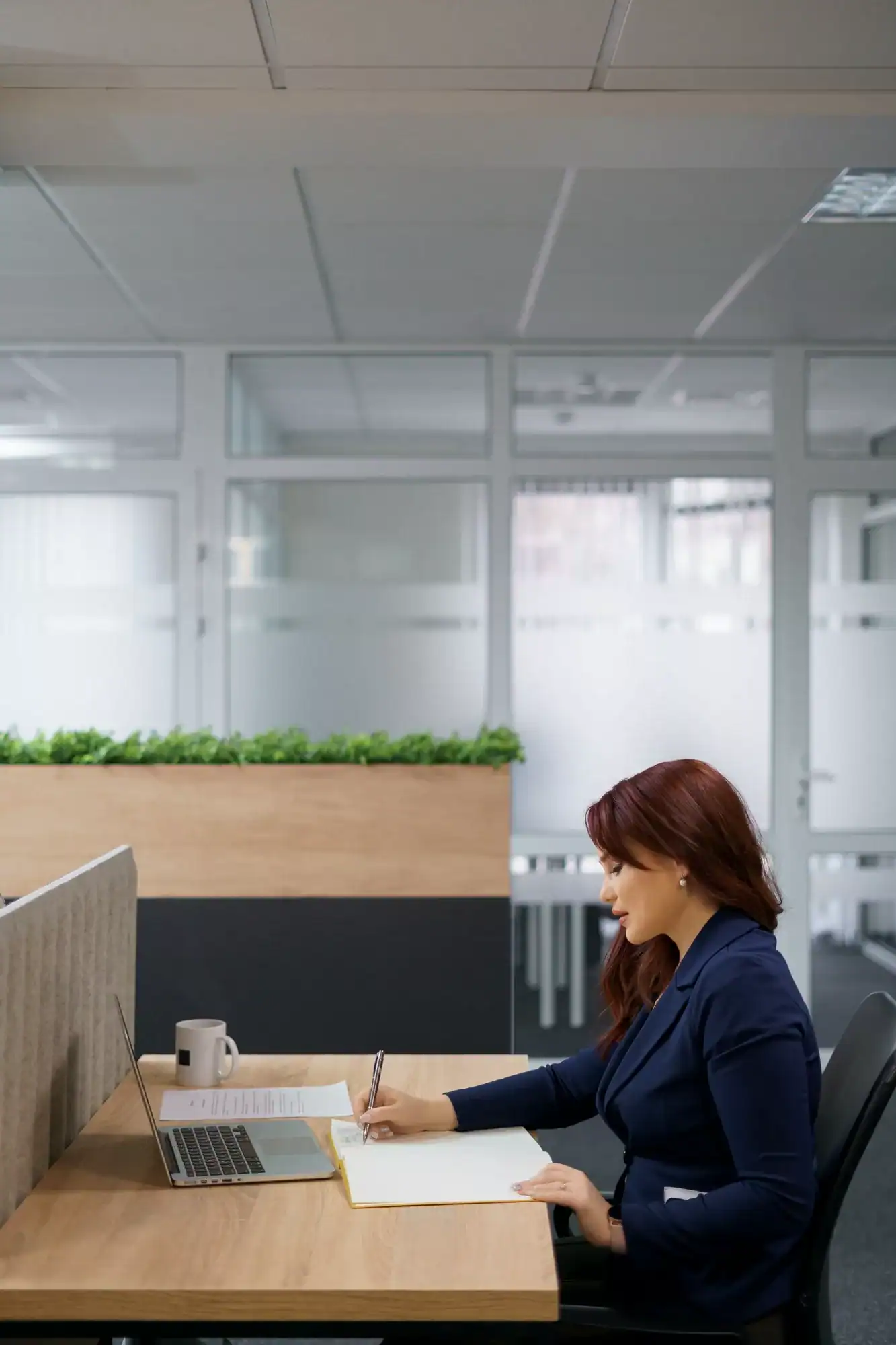 Woman working with papers in her office