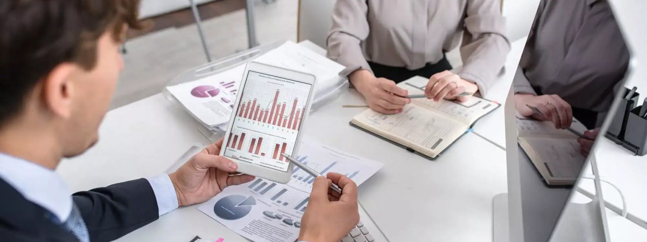 Business People Analyzing Marketing and Finance Report