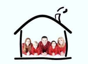 A family of five in red tops lies side by side, smiling inside a simple black outline drawing of a house with a chimney—capturing cozy moments common in hot water heated homes throughout St. Paul Minneapolis.