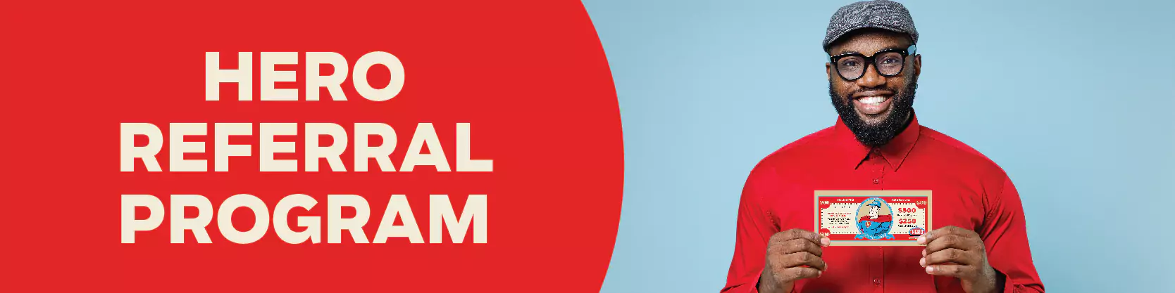Man in red shirt and cap holding a referral card, standing next to bold text that reads "Hero Referral Program" on a red background.