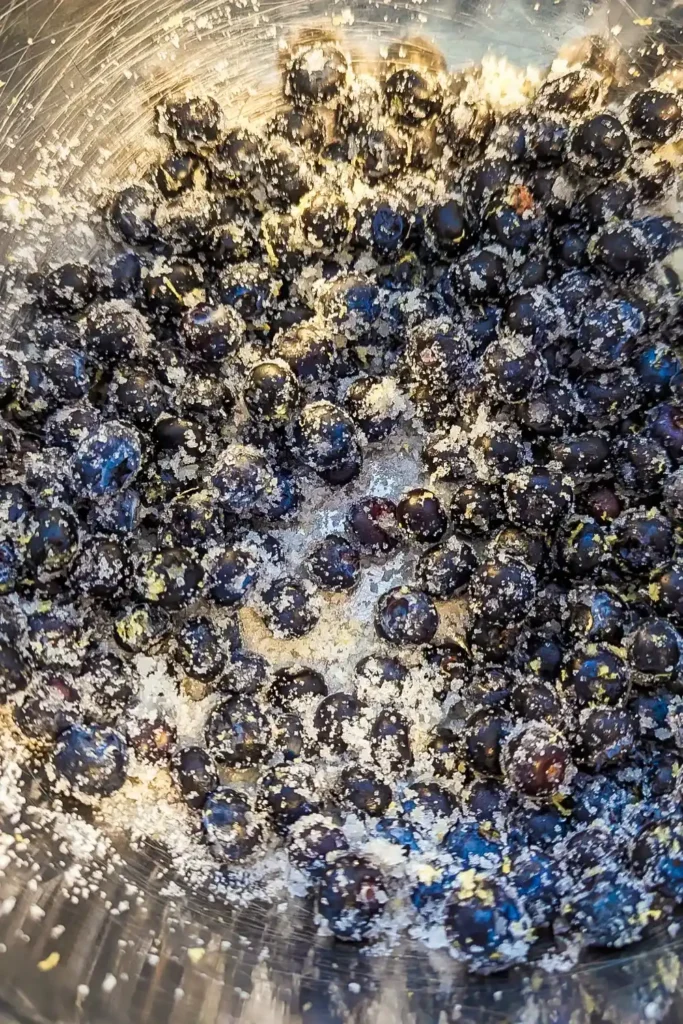 mixing the berries with sugar