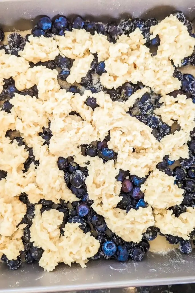 adding the remaining dough as crumble topping for the bars