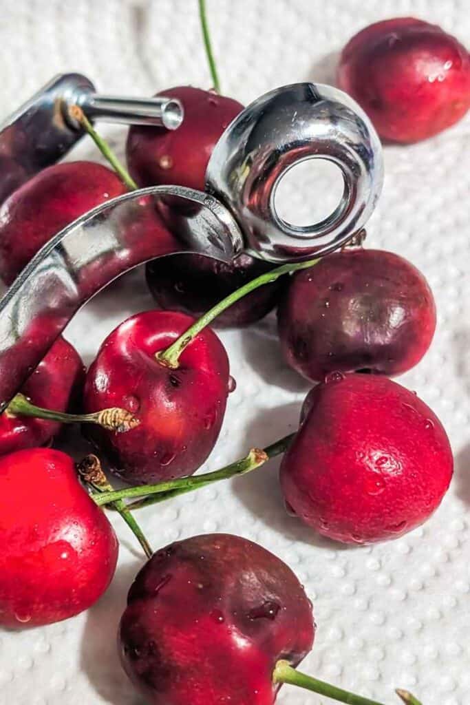cherry pitter and cherries