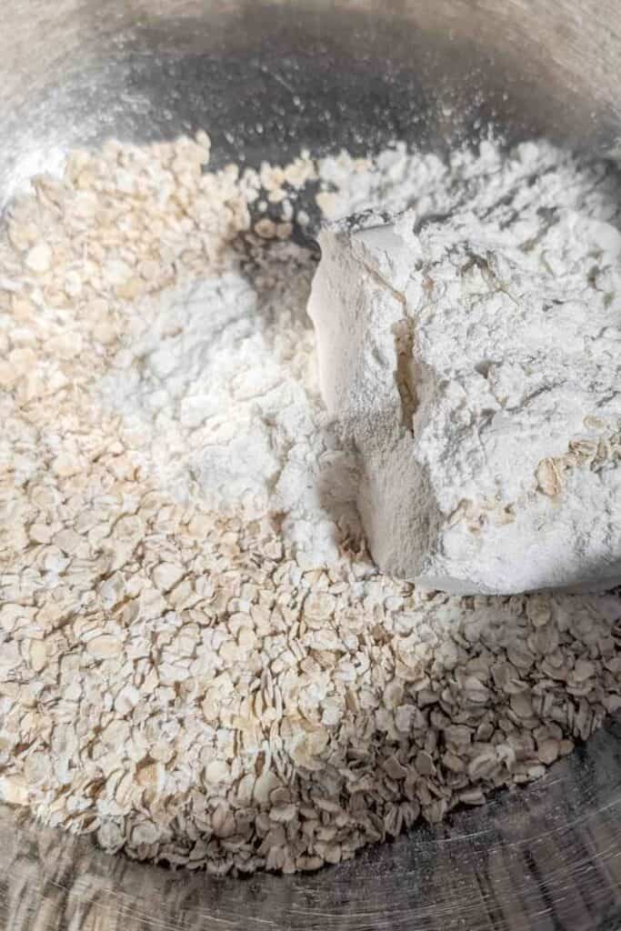 oatmeal added to flour in mixing bowl
