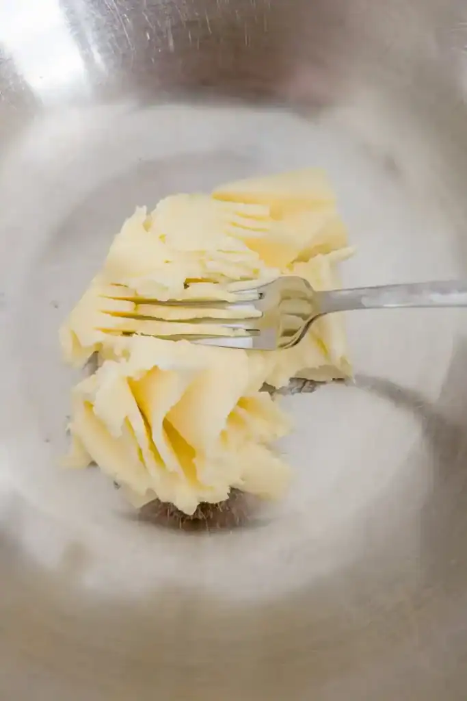 add softened butter to bowl