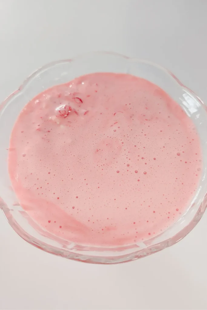 the raspberry cheesecake salad after setting top down view on glass dessert cup