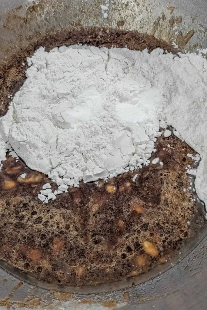 coffee water added and adding dry ingredients to mixing bowl