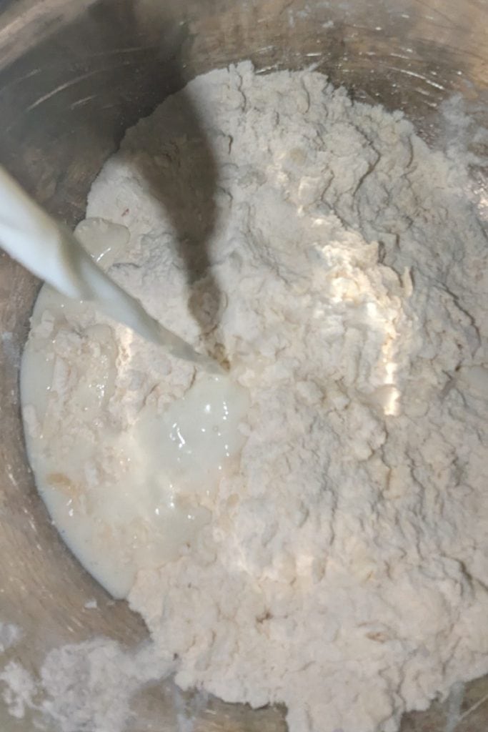add milk to dry biscuit dough
