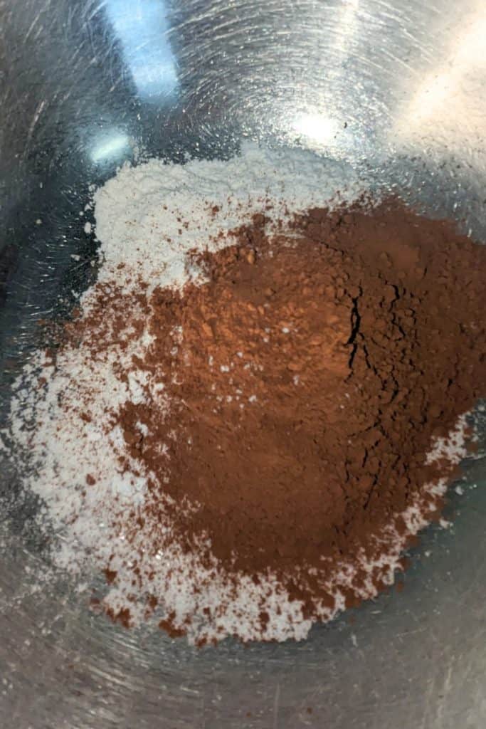 adding dry ingredients to brownies